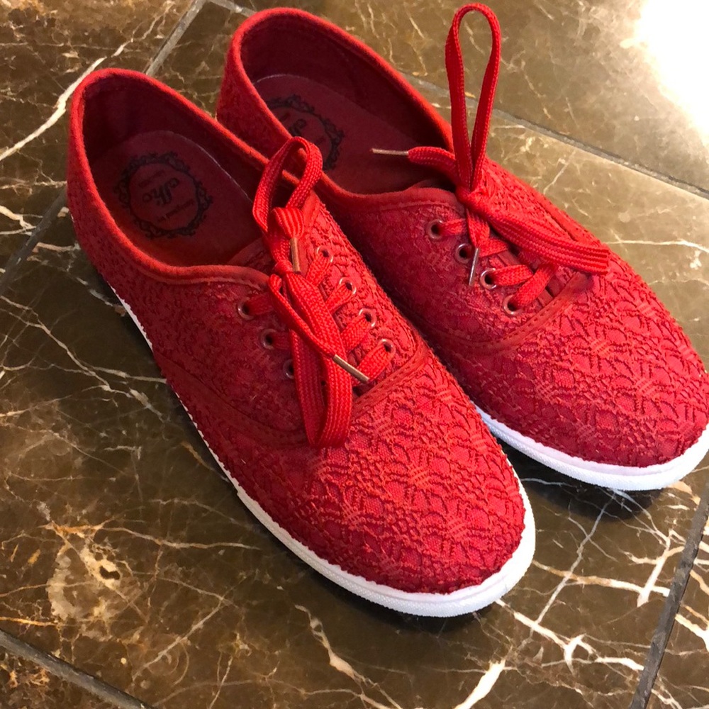 Red canvas shoes. Designed by Olho